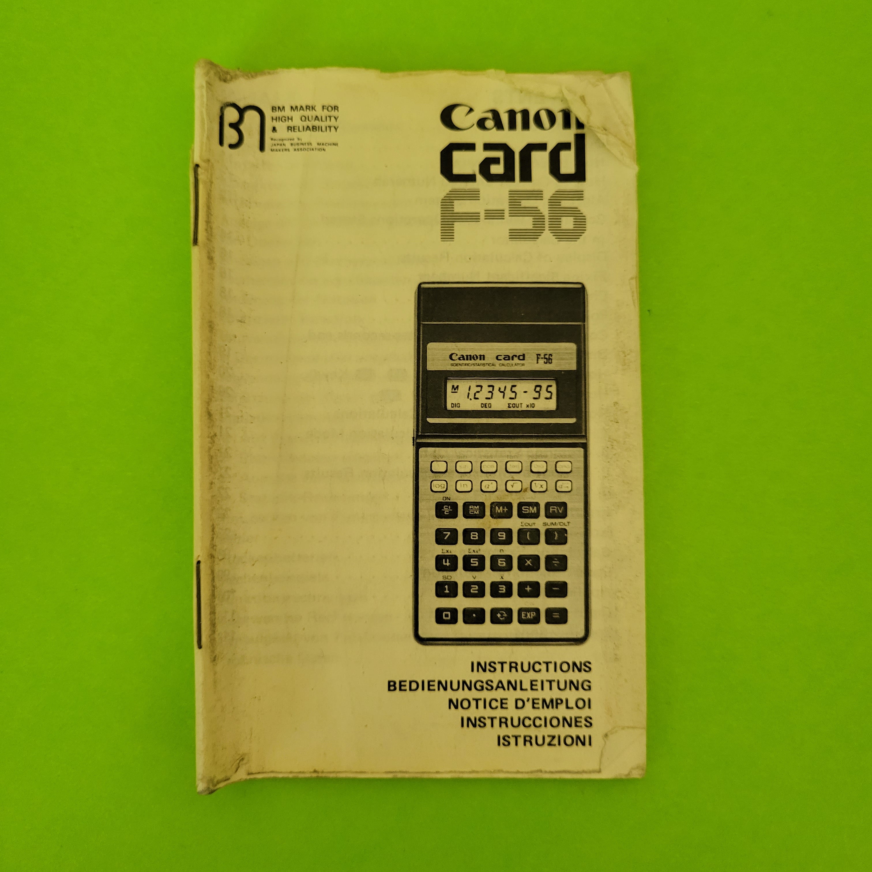 An image of instruction book of a canon card f-56 scientific/engineering calculator